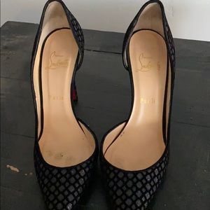 Black Christian Louboutin pairs with dust bags